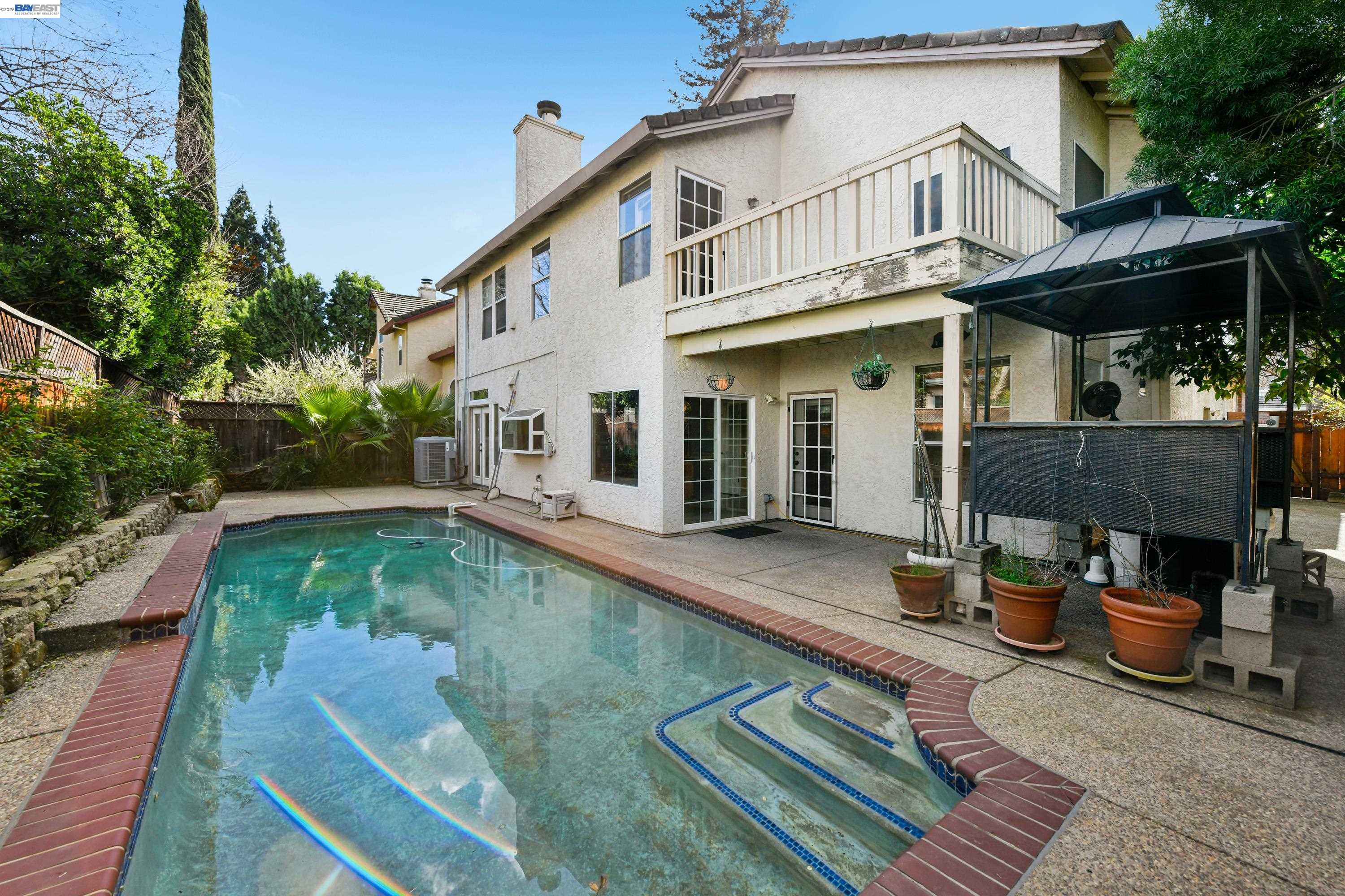 110 Conductor Way Folsom, CA 95630 - Photo 25 of 27 a view of a patio with table and chairs with wooden floor and fence