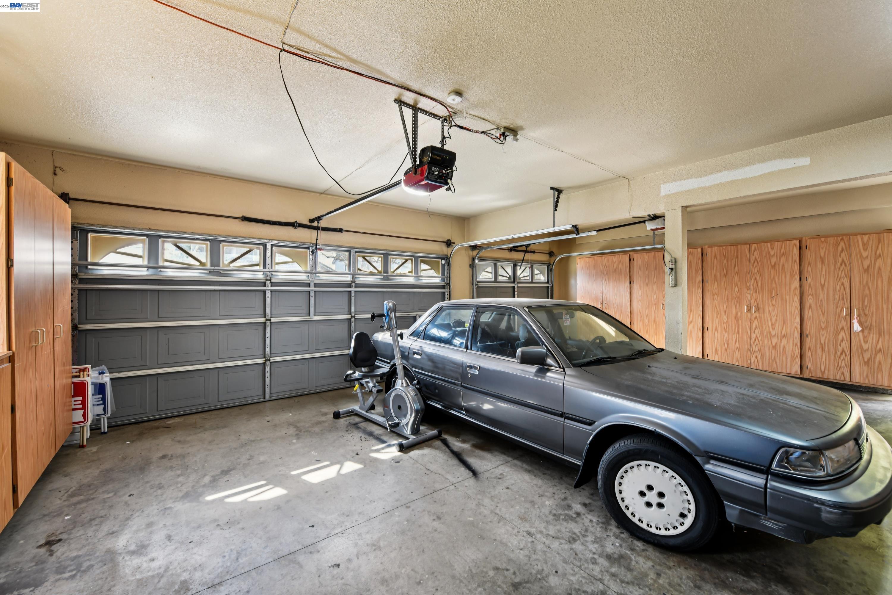 110 Conductor Way Folsom, CA 95630 - Photo 27 of 27 a view of a car garage with a car parked in it