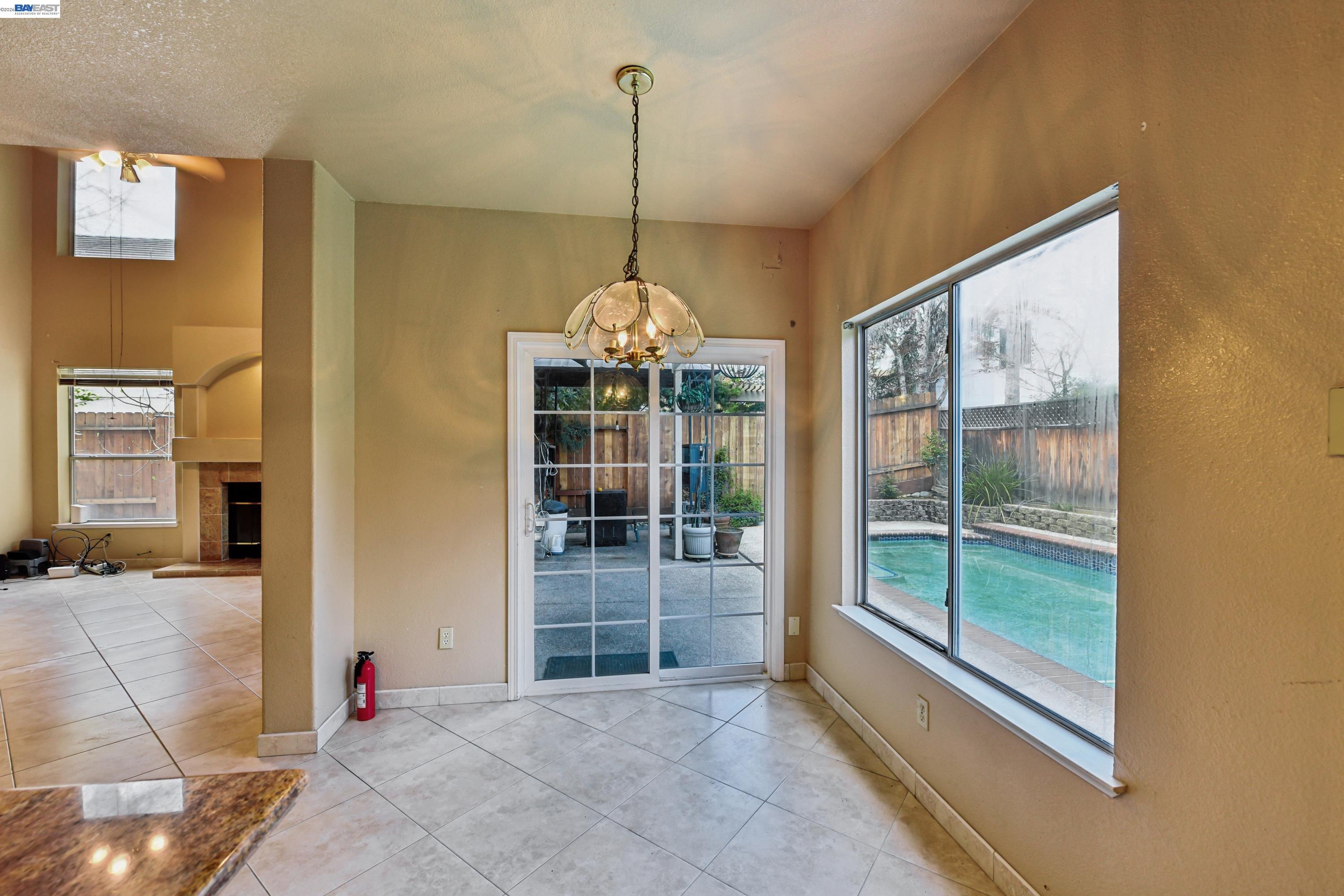 110 Conductor Way Folsom, CA 95630 - Photo 8 of 27 a room with window and a chandelier