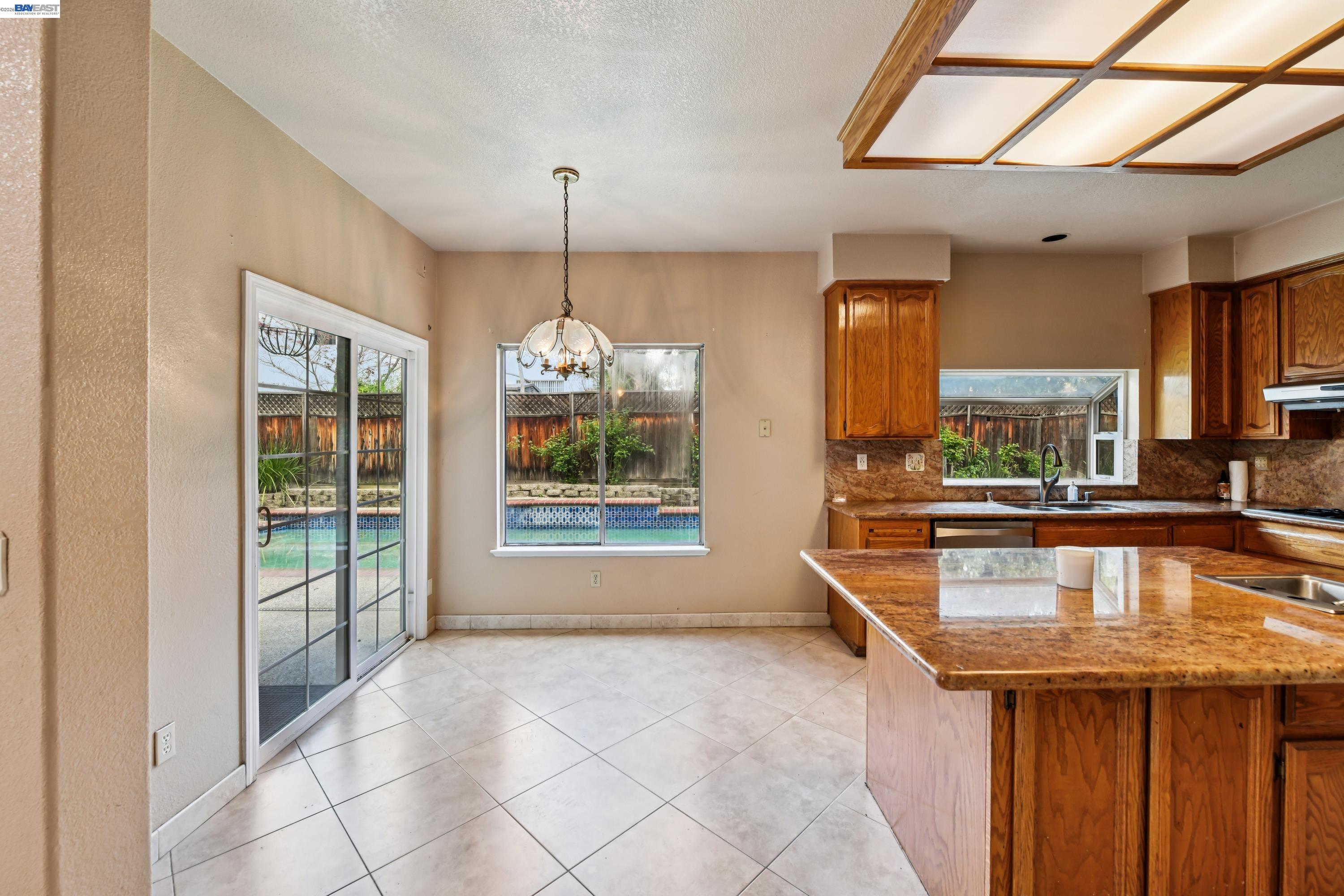 110 Conductor Way Folsom, CA 95630 - Photo 9 of 27 a very nice looking room with a large window and chandelier