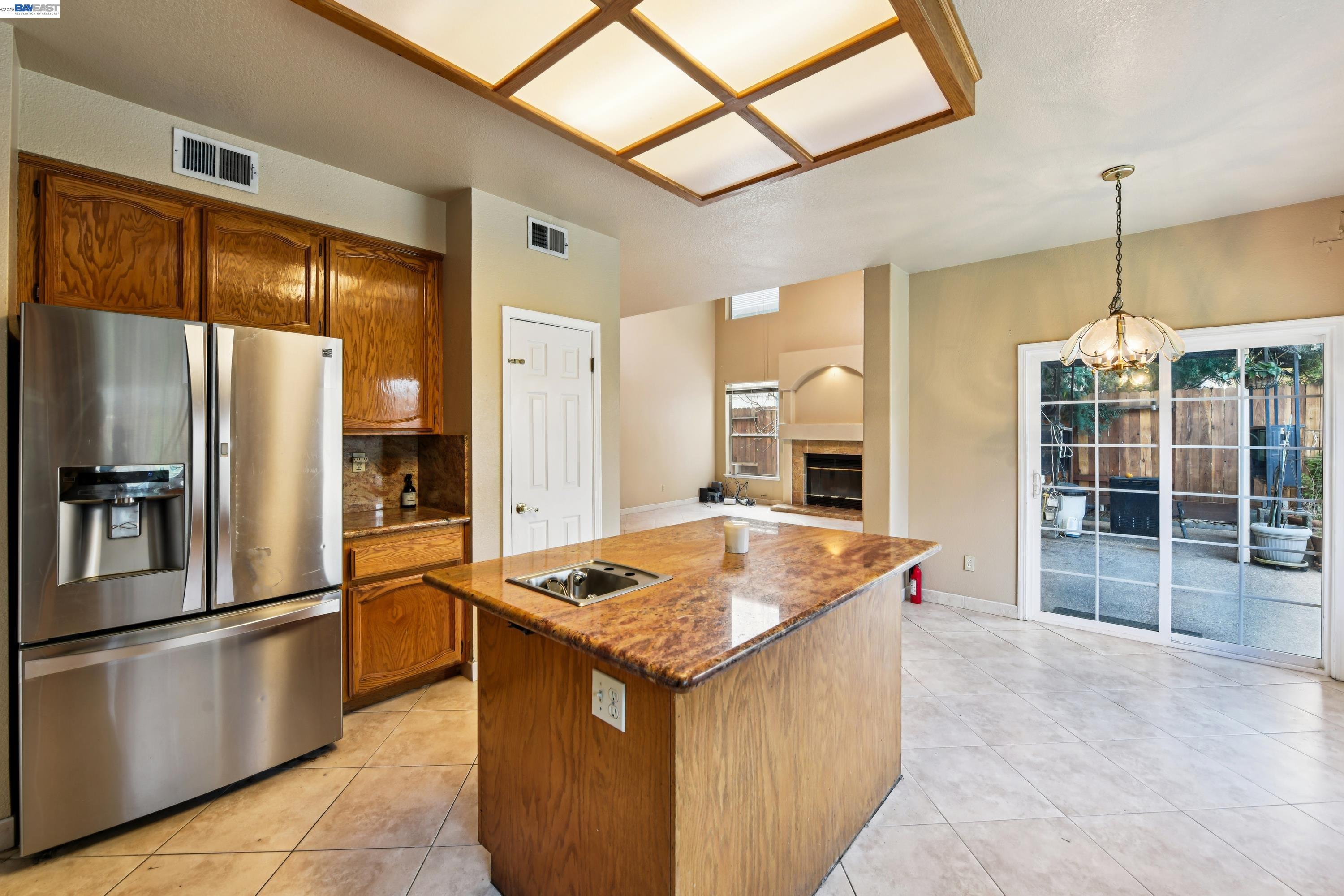 110 Conductor Way Folsom, CA 95630 - Photo 10 of 27 a kitchen with stainless steel appliances granite countertop a sink stove and refrigerator