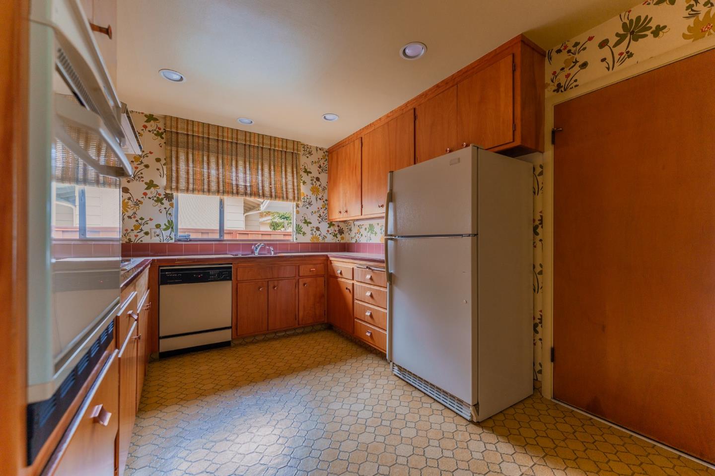 247 Encinada Drive Salinas, CA 93901 - Photo 12 of 26 a kitchen with stainless steel appliances granite countertop a refrigerator a sink a stove and a refrigerator