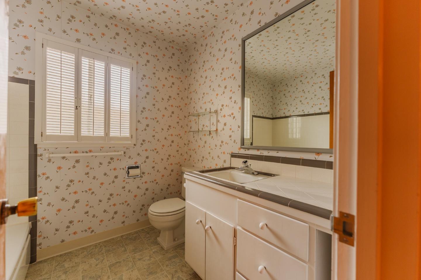 247 Encinada Drive Salinas, CA 93901 - Photo 20 of 26 a bathroom with a granite countertop sink toilet and mirror