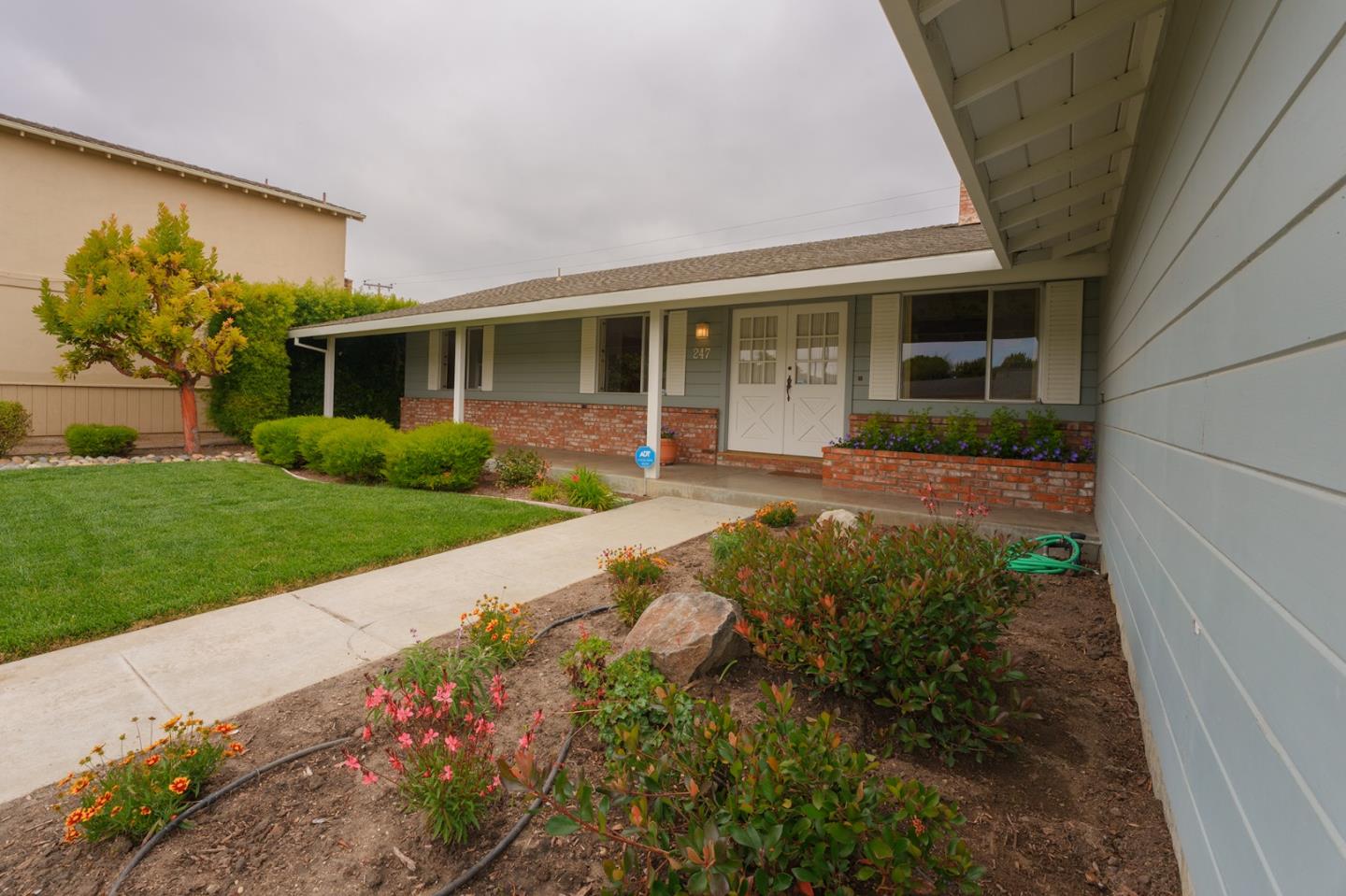 247 Encinada Drive Salinas, CA 93901 - Photo 4 of 26 a front view of a house with garden