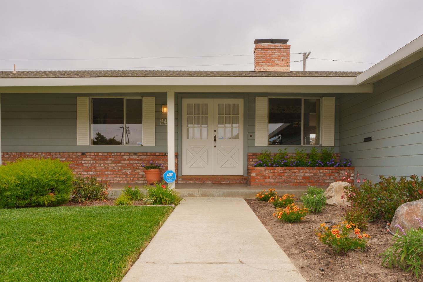 247 Encinada Drive Salinas, CA 93901 - Photo 5 of 26 a front view of a house with a garden