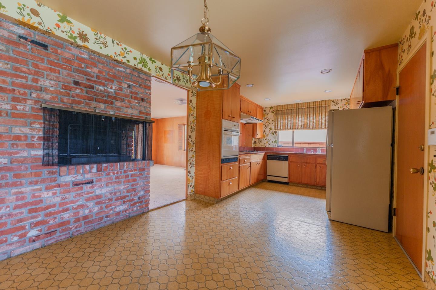 247 Encinada Drive Salinas, CA 93901 - Photo 10 of 26 a view of a kitchen with refrigerator and a stove