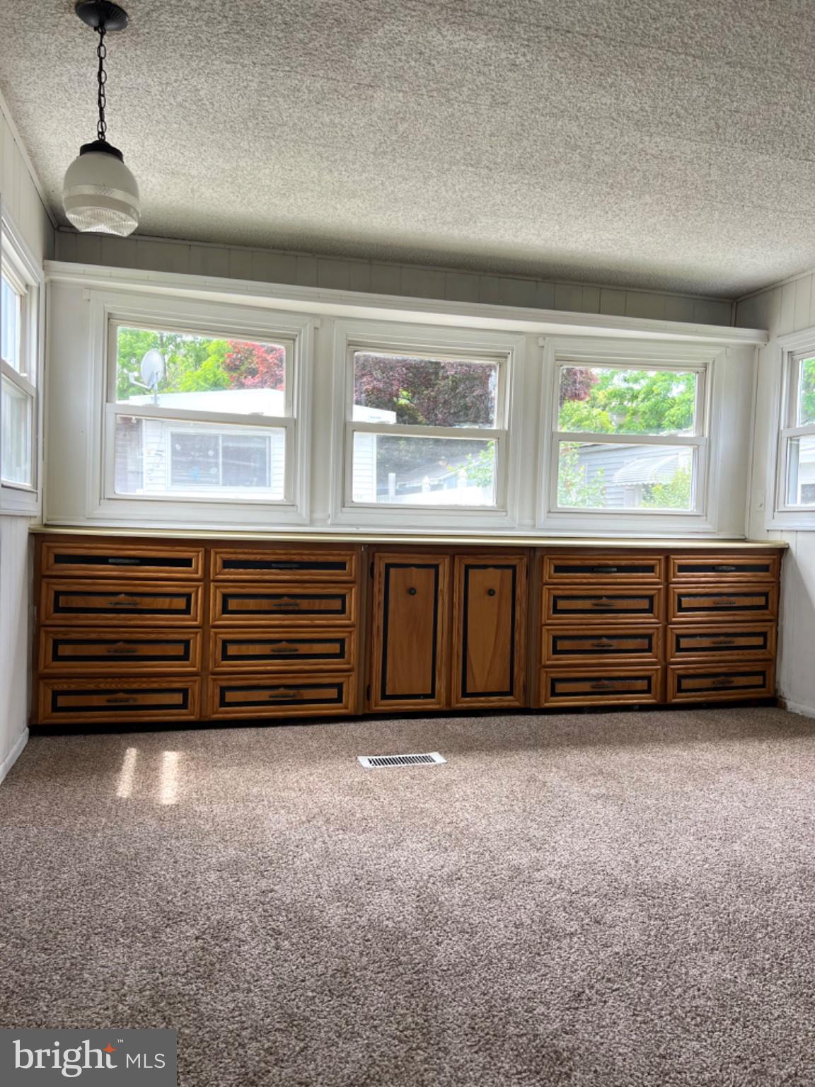 1302 Gibson Road, Unit 152 Bensalem, PA 19020 - Photo 10 of 18 a view of a room with furniture and windows
