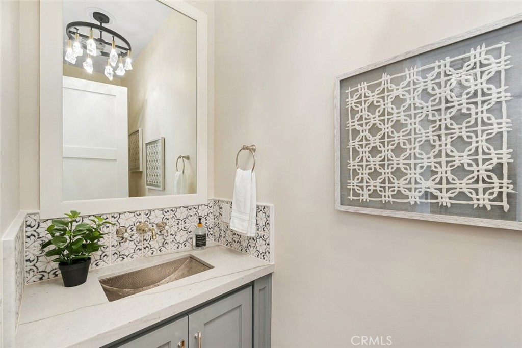 610 Spanish Springs Drive San Luis Obispo, CA 93401 - Photo 48 of 75 a bathroom with a sink and a mirror