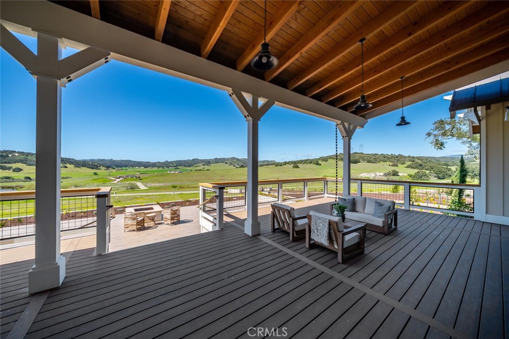 610 Spanish Springs Drive San Luis Obispo, CA 93401 - Photo 53 of 75 a roof deck with table and chairs and wooden floor