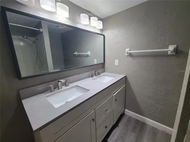 a bathroom with a tub and shower