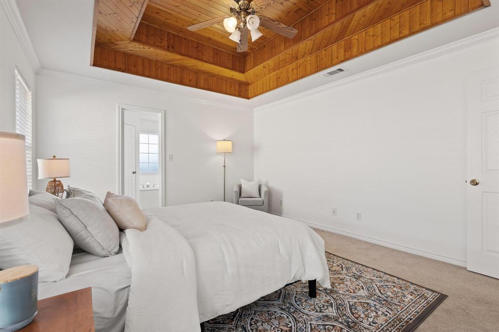 623 Madison Place Sherman, TX 75092 - Photo 17 of 37 a bedroom with a bed and a dresser