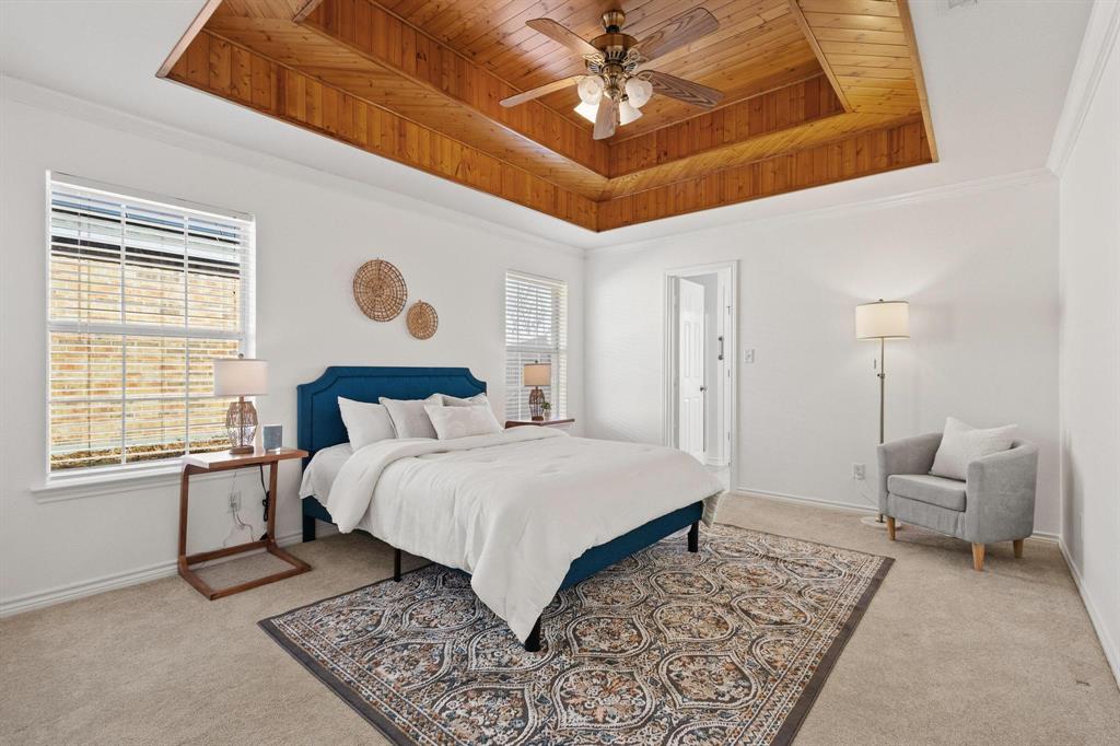 623 Madison Place Sherman, TX 75092 - Photo 18 of 37 a bedroom with a large bed rug and a window