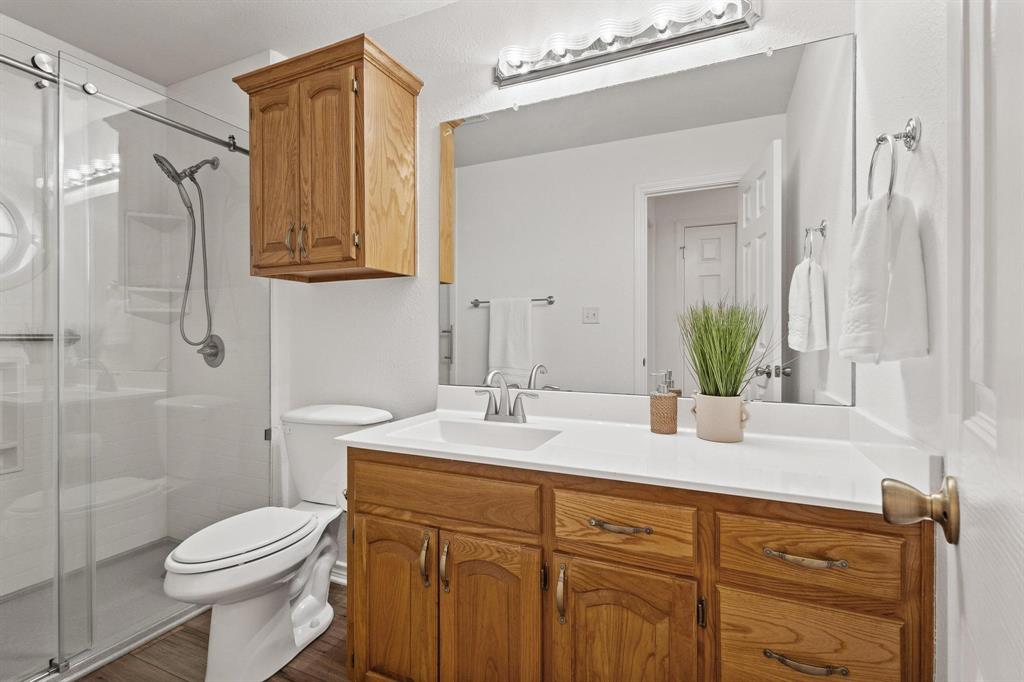 623 Madison Place Sherman, TX 75092 - Photo 26 of 37 a bathroom with a sink a toilet and shower