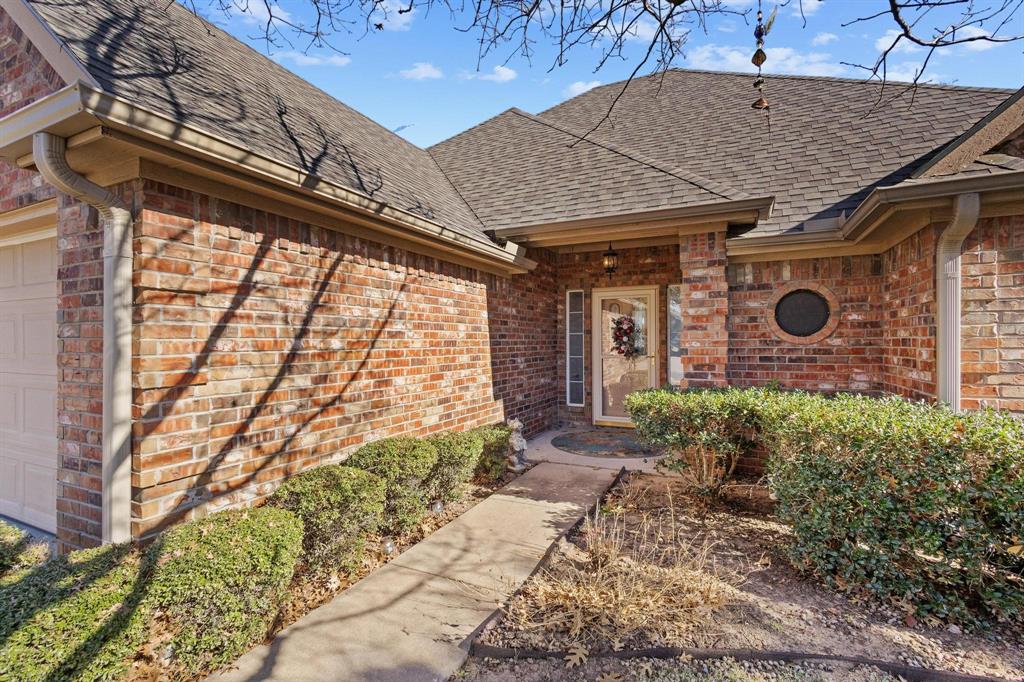 623 Madison Place Sherman, TX 75092 - Photo 3 of 37 a front view of a house with garden