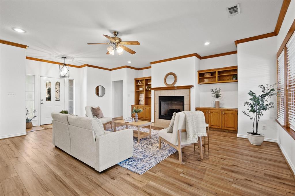 623 Madison Place Sherman, TX 75092 - Photo 6 of 37 a living room with furniture and a fireplace
