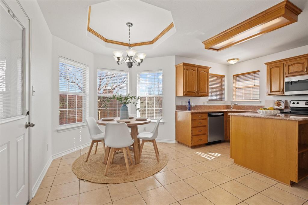 623 Madison Place Sherman, TX 75092 - Photo 8 of 37 a dining room with granite countertop a sink and chairs