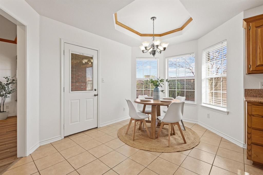 623 Madison Place Sherman, TX 75092 - Photo 9 of 37 a view of a dining room with furniture wooden floor and chandelier