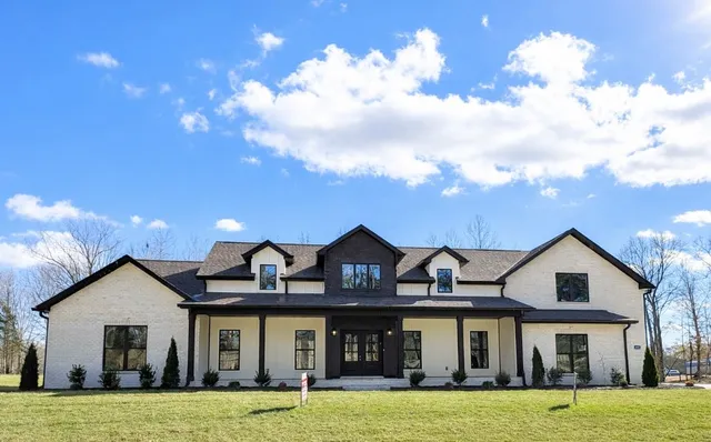 a view of a living room and kitchen