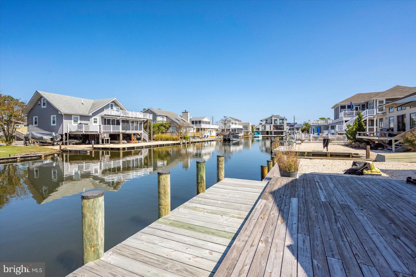 409 Bristol Road South Bethany, DE 19930 - Photo 64 of 89 a view of a lake with boats and trees in the background