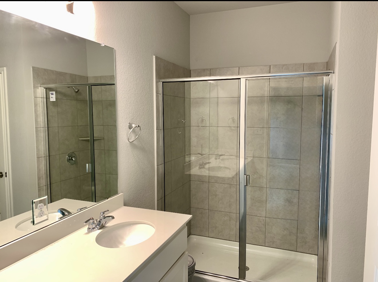 119 Wild Wind Cove Jarrell, TX 76537 - Photo 7 of 16 Bathroom with a textured wall, vanity, and a shower stall