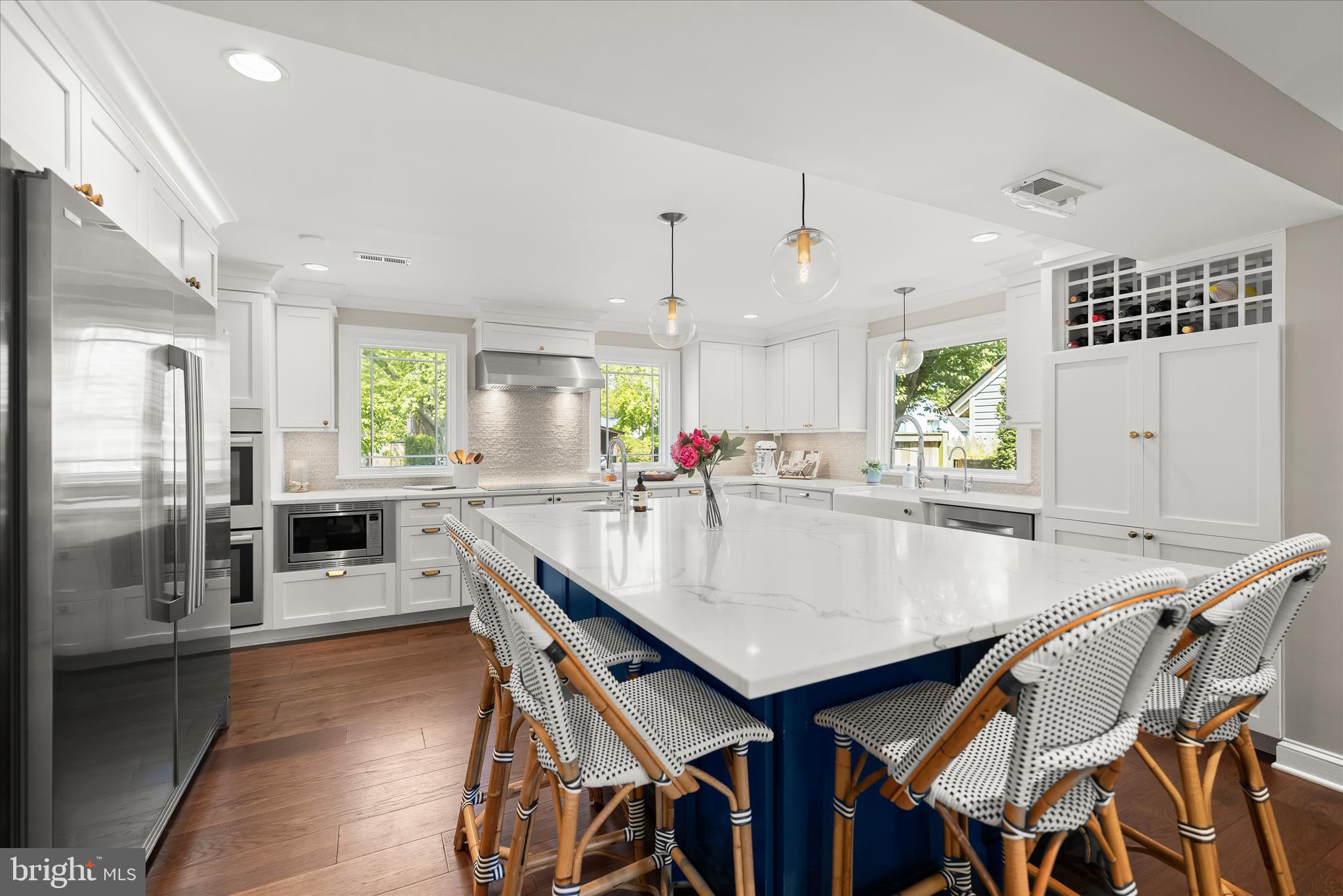 6366 11th Road North Arlington, VA 22205 - Photo 3 of 39 a kitchen with granite countertop a table chairs stainless steel appliances and window