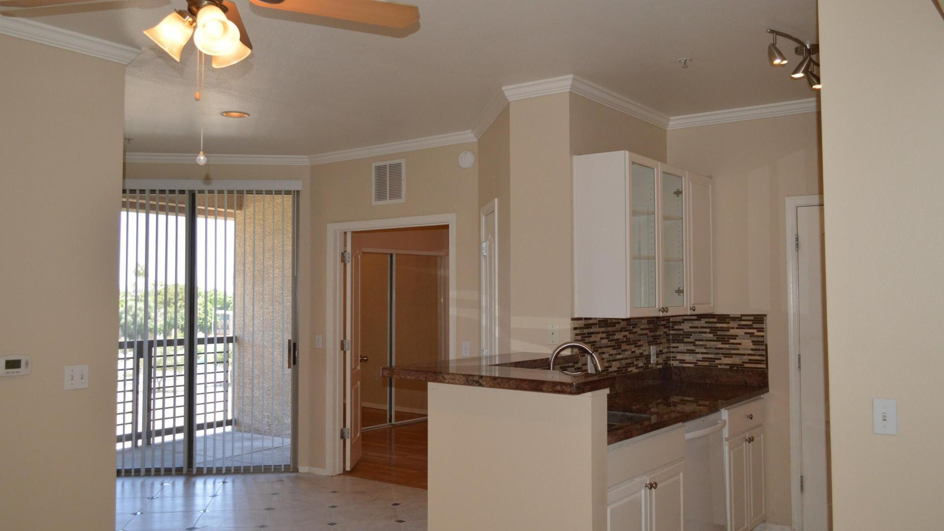 a kitchen with a sink and a refrigerator