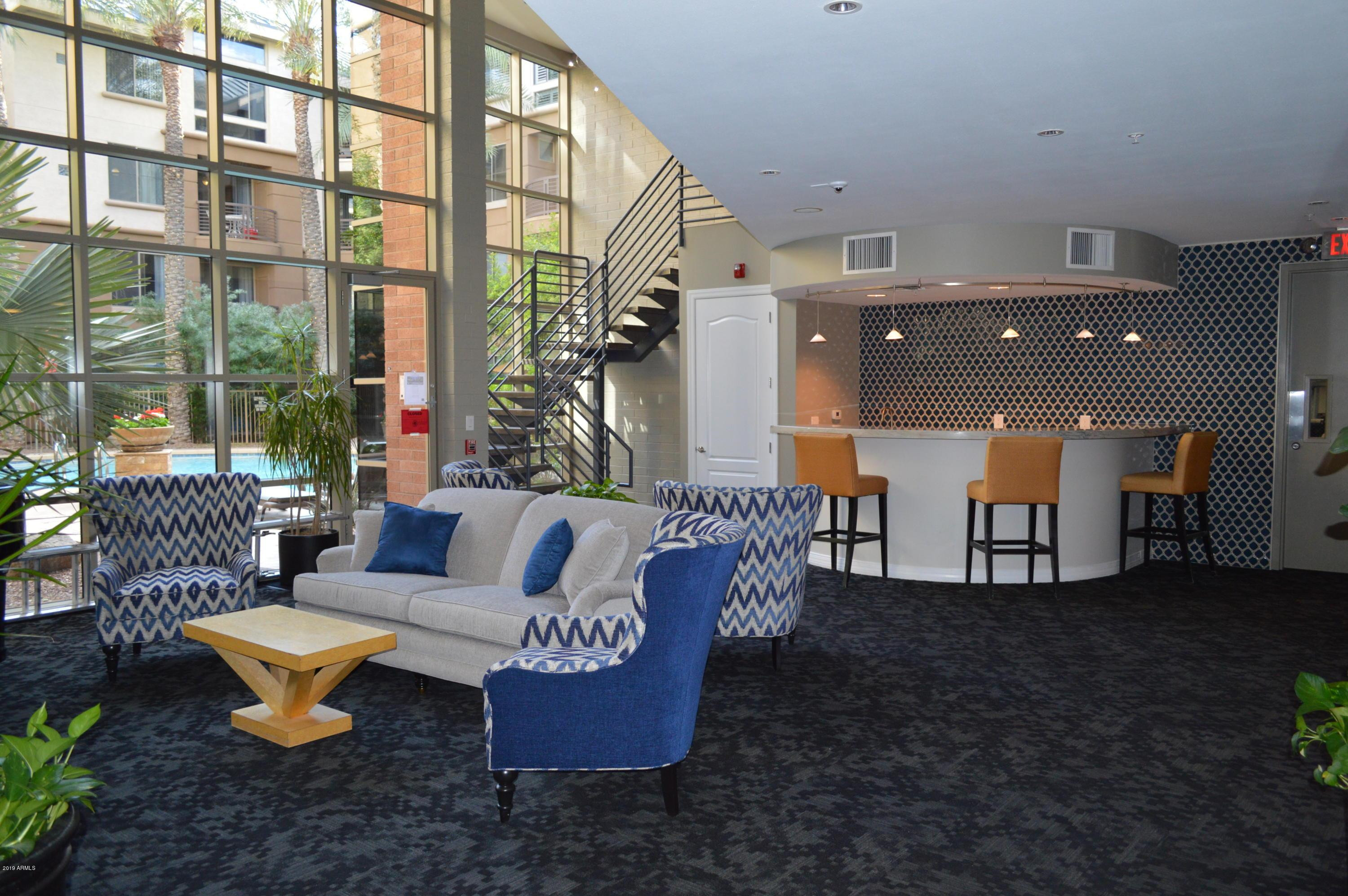 1701 East Colter Street, Unit 454 Phoenix, AZ 85016 - Photo 12 of 40 a outdoor living space with patio furniture and a potted plant
