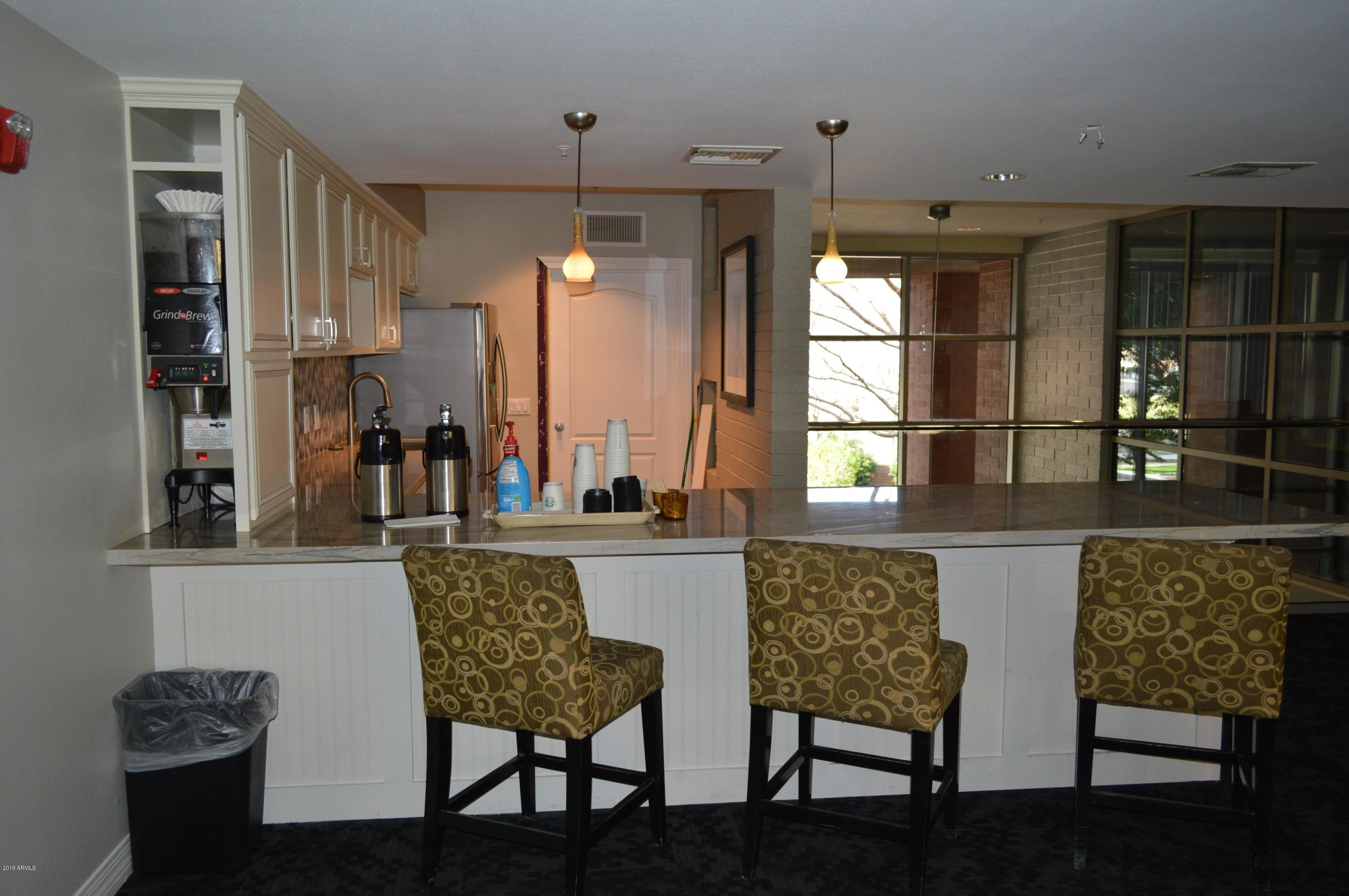 1701 East Colter Street, Unit 454 Phoenix, AZ 85016 - Photo 13 of 40 a dining room with furniture and window