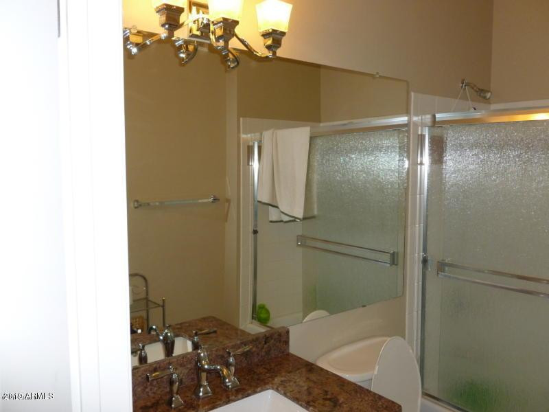1701 East Colter Street, Unit 454 Phoenix, AZ 85016 - Photo 2 of 40 a bathroom with a shower and a sink