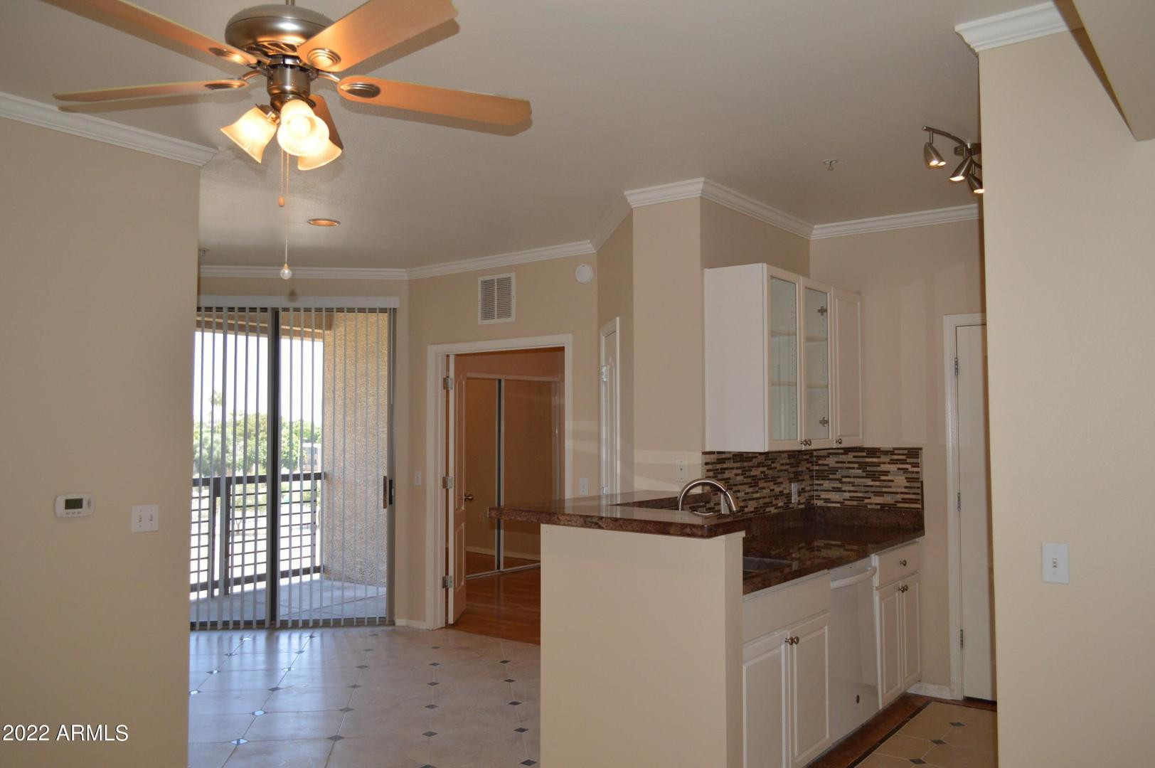 1701 East Colter Street, Unit 454 Phoenix, AZ 85016 - Photo 23 of 40 a kitchen with a refrigerator a stove cabinets and wooden floor