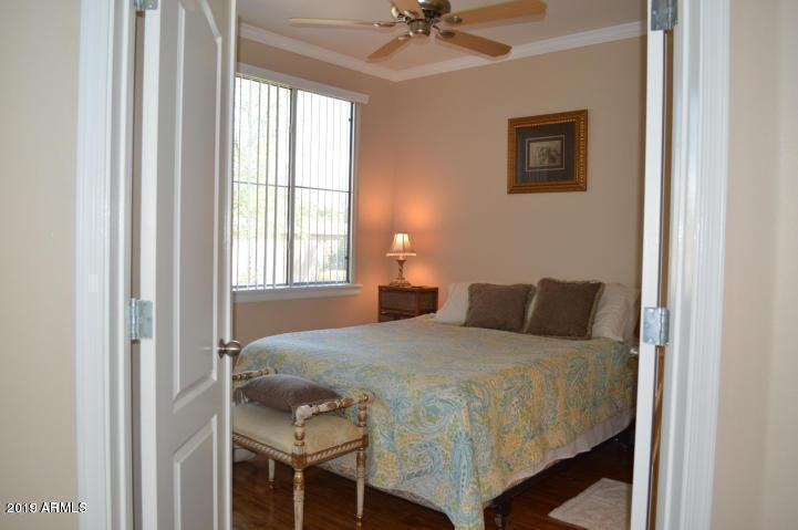 1701 East Colter Street, Unit 454 Phoenix, AZ 85016 - Photo 3 of 40 a bedroom with a bed and window