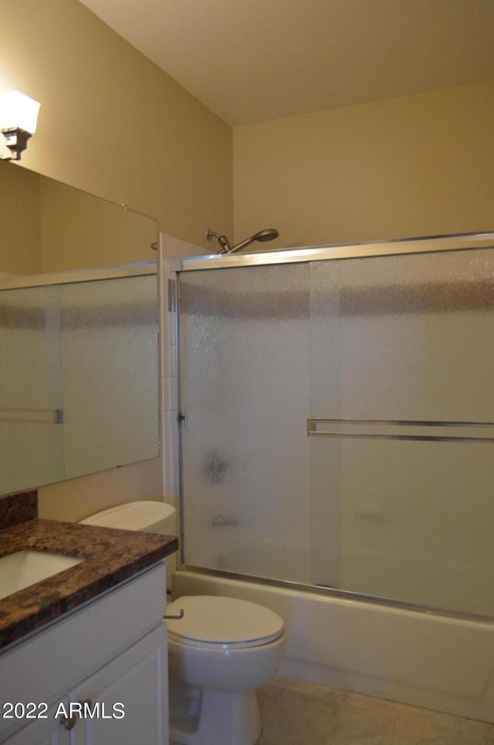 1701 East Colter Street, Unit 454 Phoenix, AZ 85016 - Photo 32 of 40 a bathroom with a granite countertop sink toilet and shower