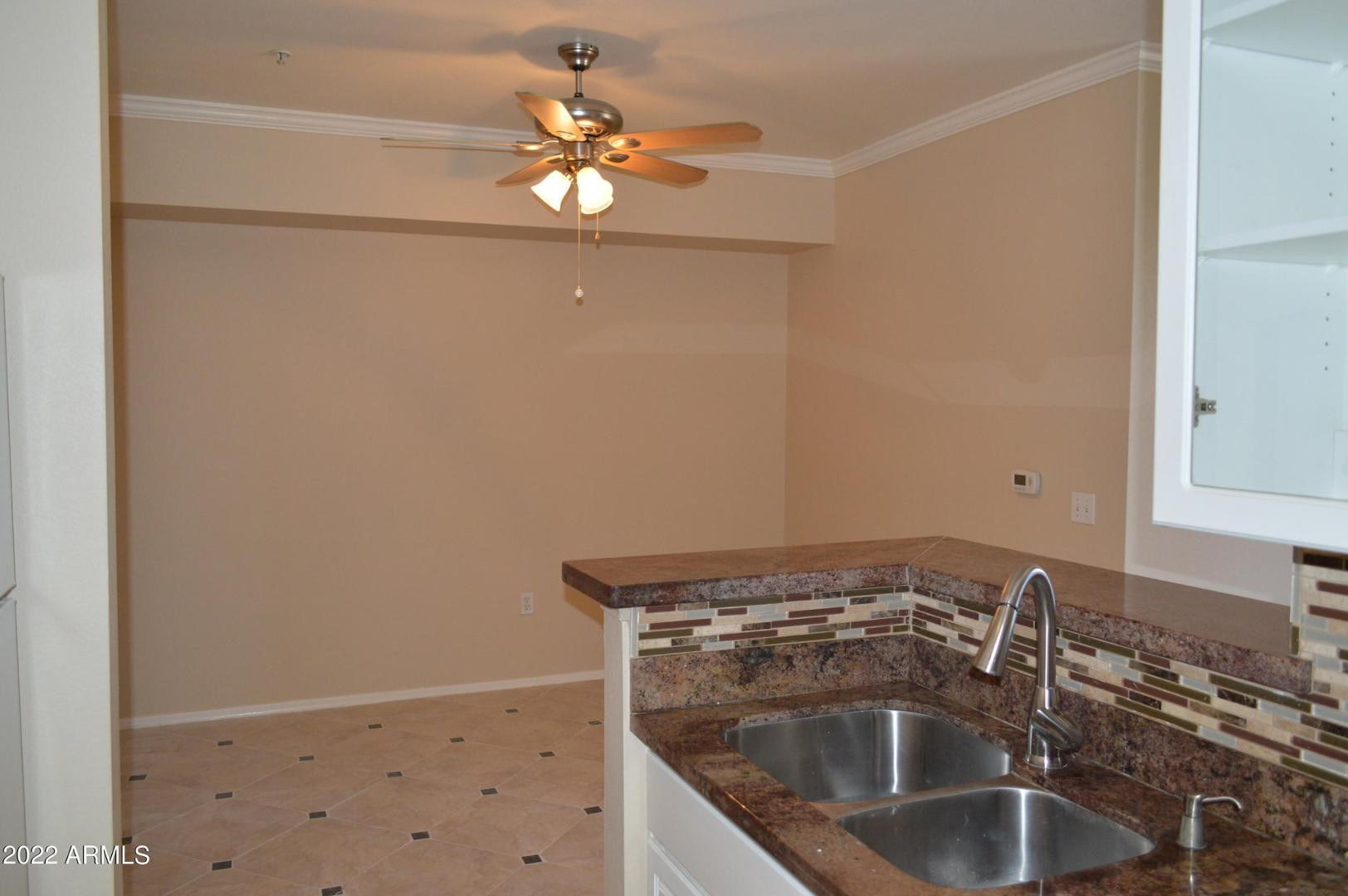 1701 East Colter Street, Unit 454 Phoenix, AZ 85016 - Photo 33 of 40 a close view of a sink a counter space and utility in a shelf