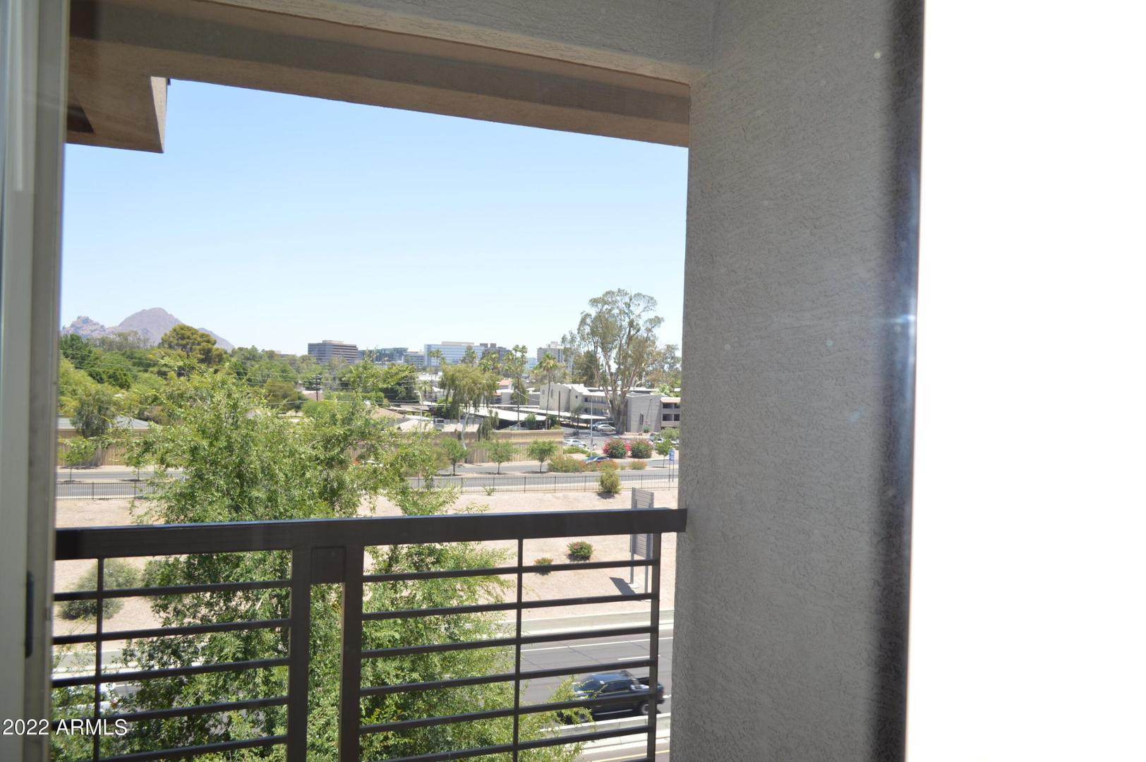 1701 East Colter Street, Unit 454 Phoenix, AZ 85016 - Photo 39 of 40 a view of a glass door with a balcony
