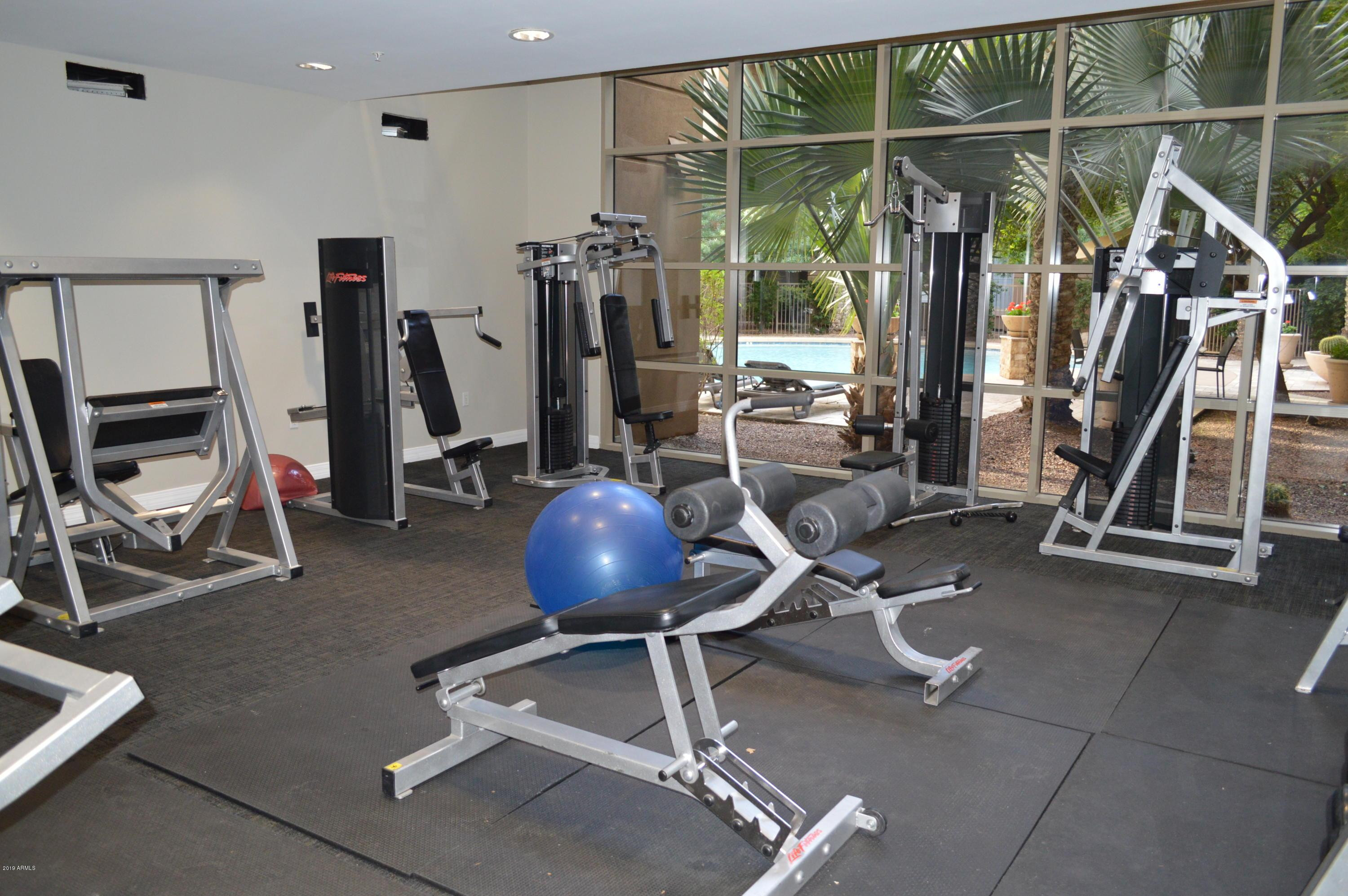 1701 East Colter Street, Unit 454 Phoenix, AZ 85016 - Photo 6 of 40 a view of a room with gym equipment