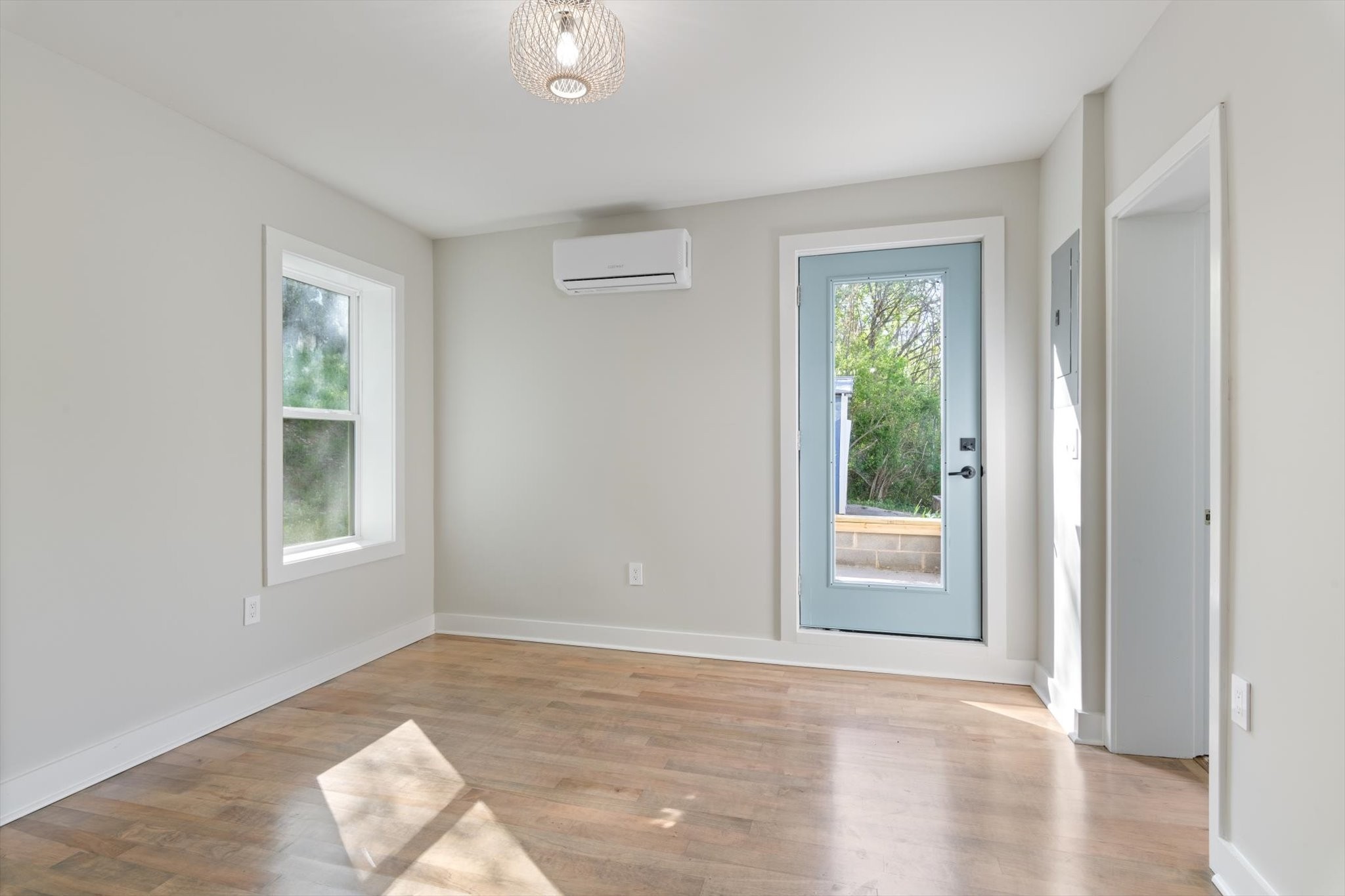 8315 West Sheepneck Road Mount Pleasant, TN 38474 - Photo 12 of 24 a view of an empty room with wooden floor and a window