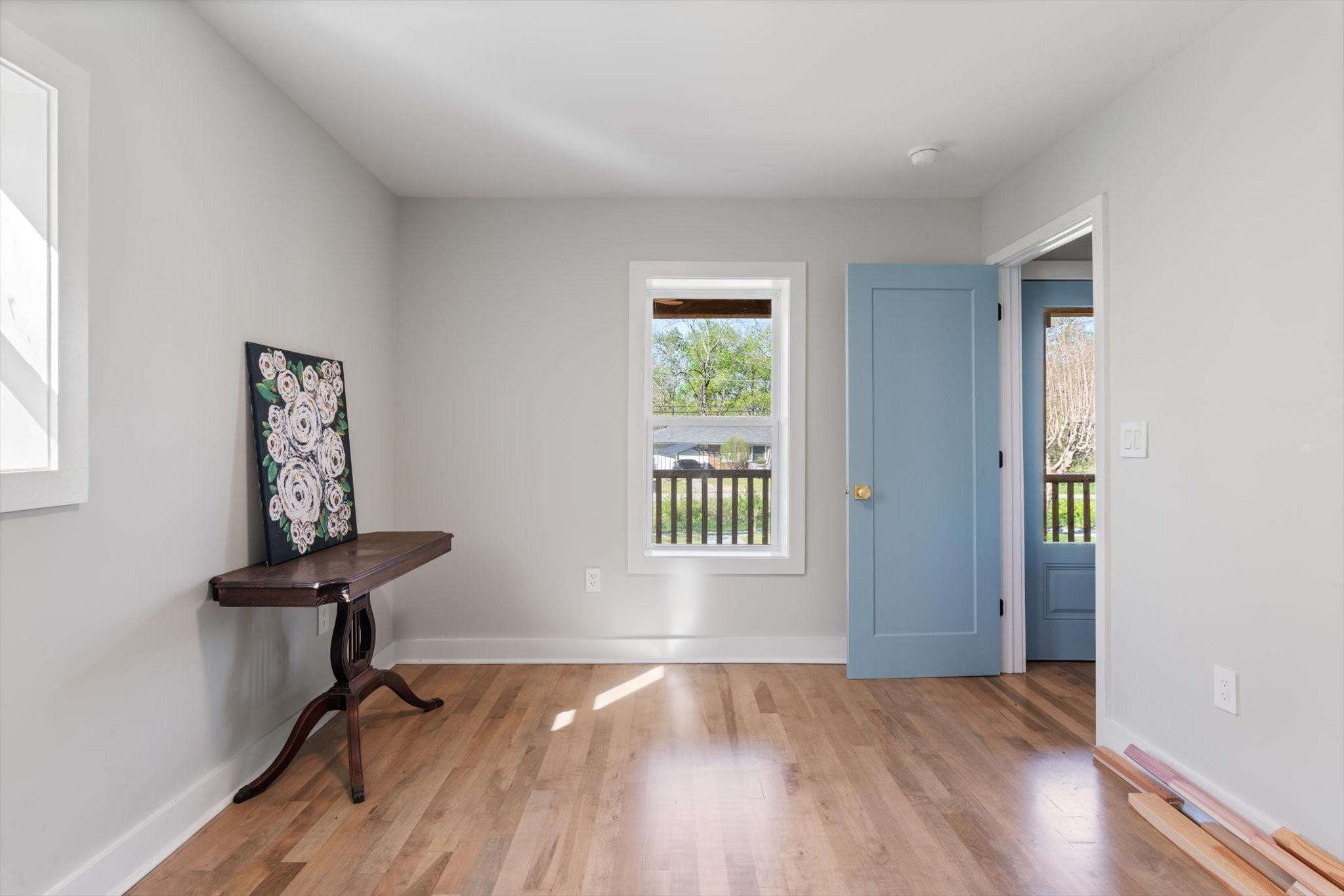 8315 West Sheepneck Road Mount Pleasant, TN 38474 - Photo 17 of 24 a view of an empty room with a window and wooden floor