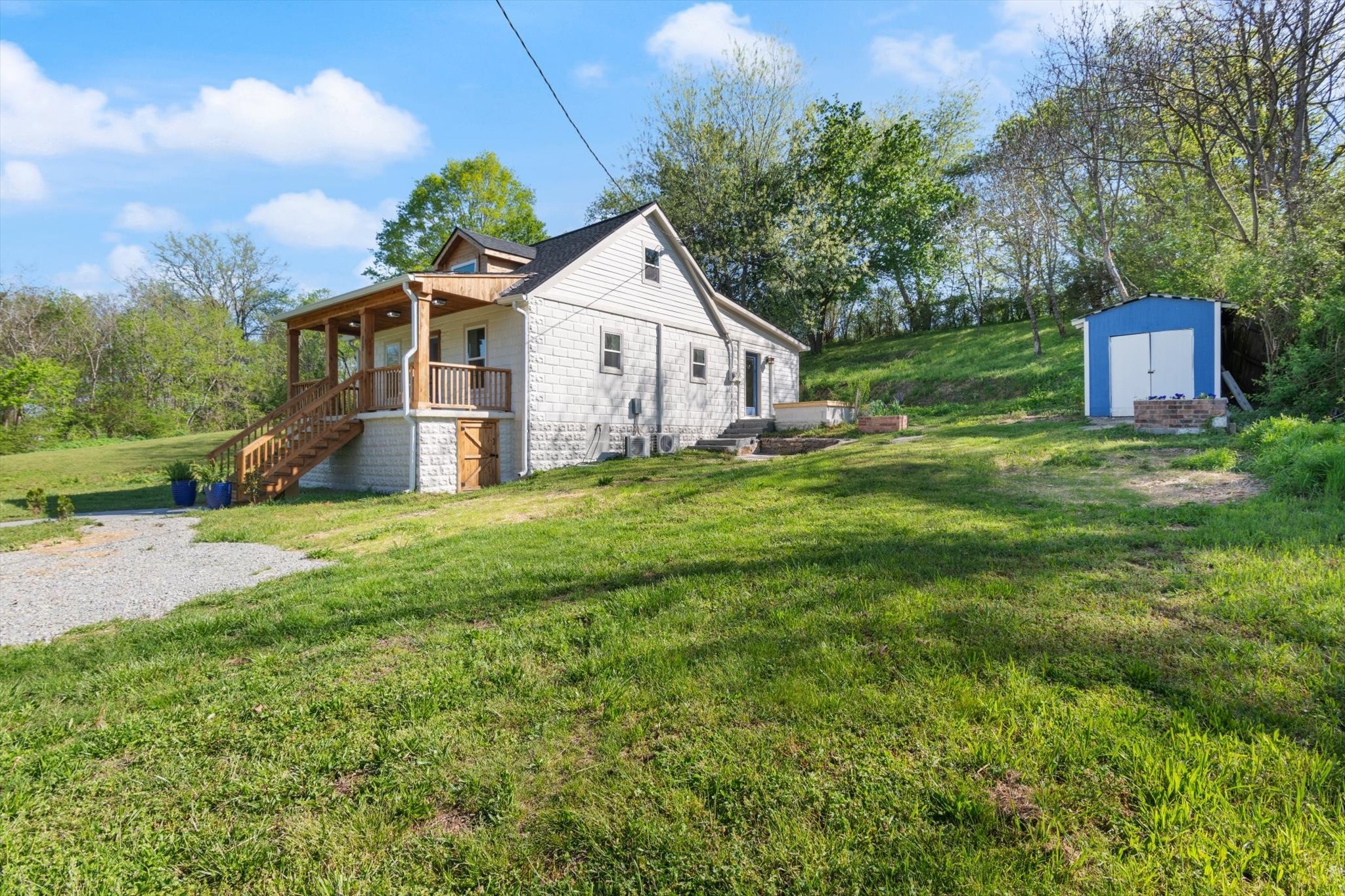 8315 West Sheepneck Road Mount Pleasant, TN 38474 - Photo 2 of 24 a front view of a house with a yard