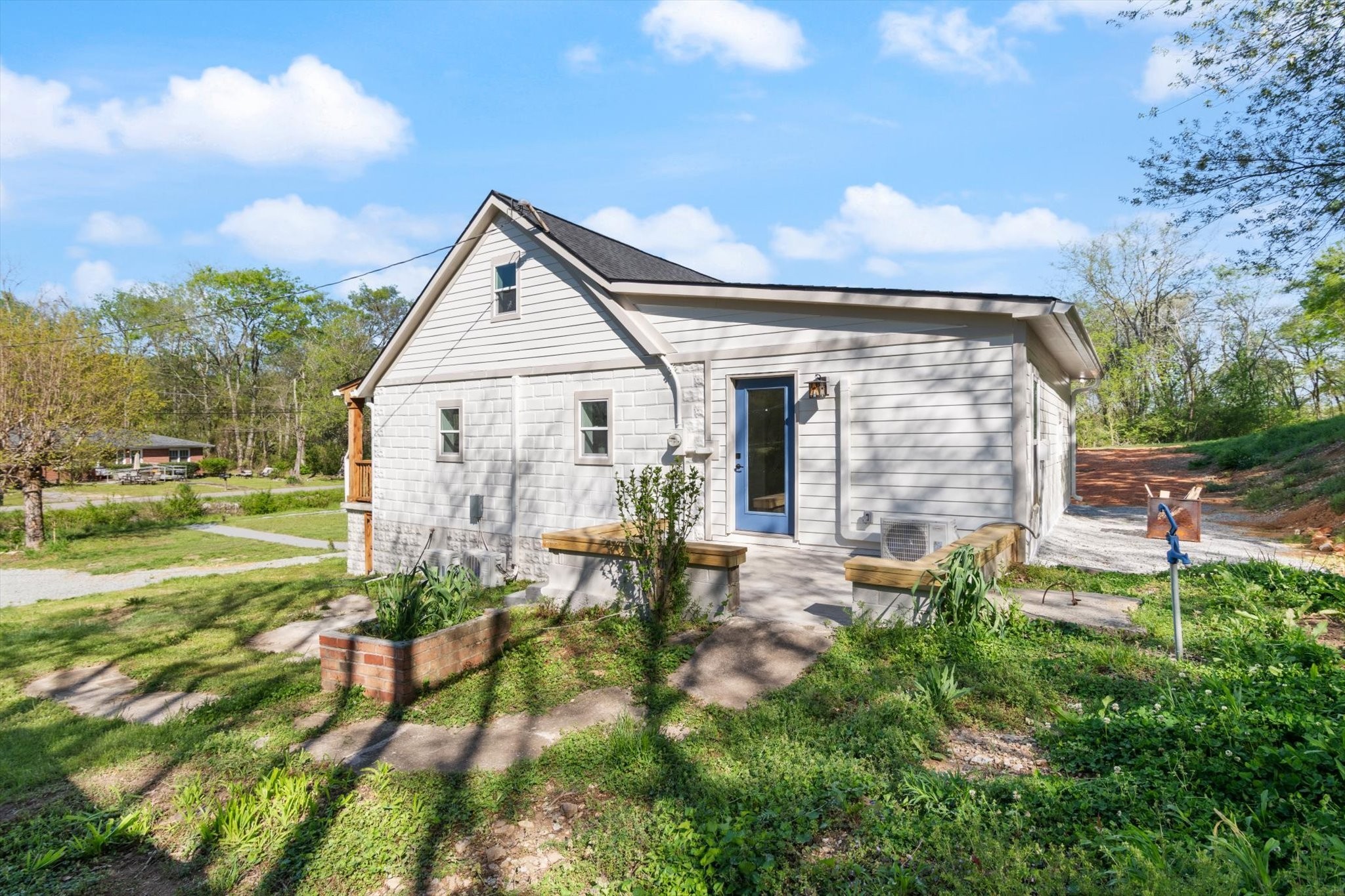 8315 West Sheepneck Road Mount Pleasant, TN 38474 - Photo 3 of 24 a front view of a house with a yard