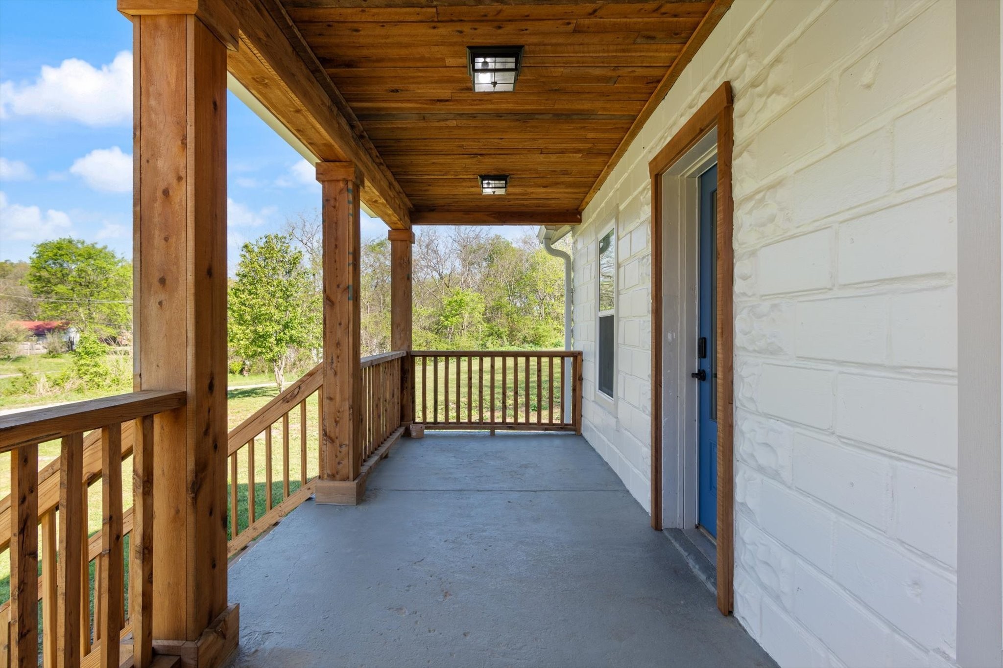 8315 West Sheepneck Road Mount Pleasant, TN 38474 - Photo 5 of 24 a view of a porch with wooden floor in front of a house