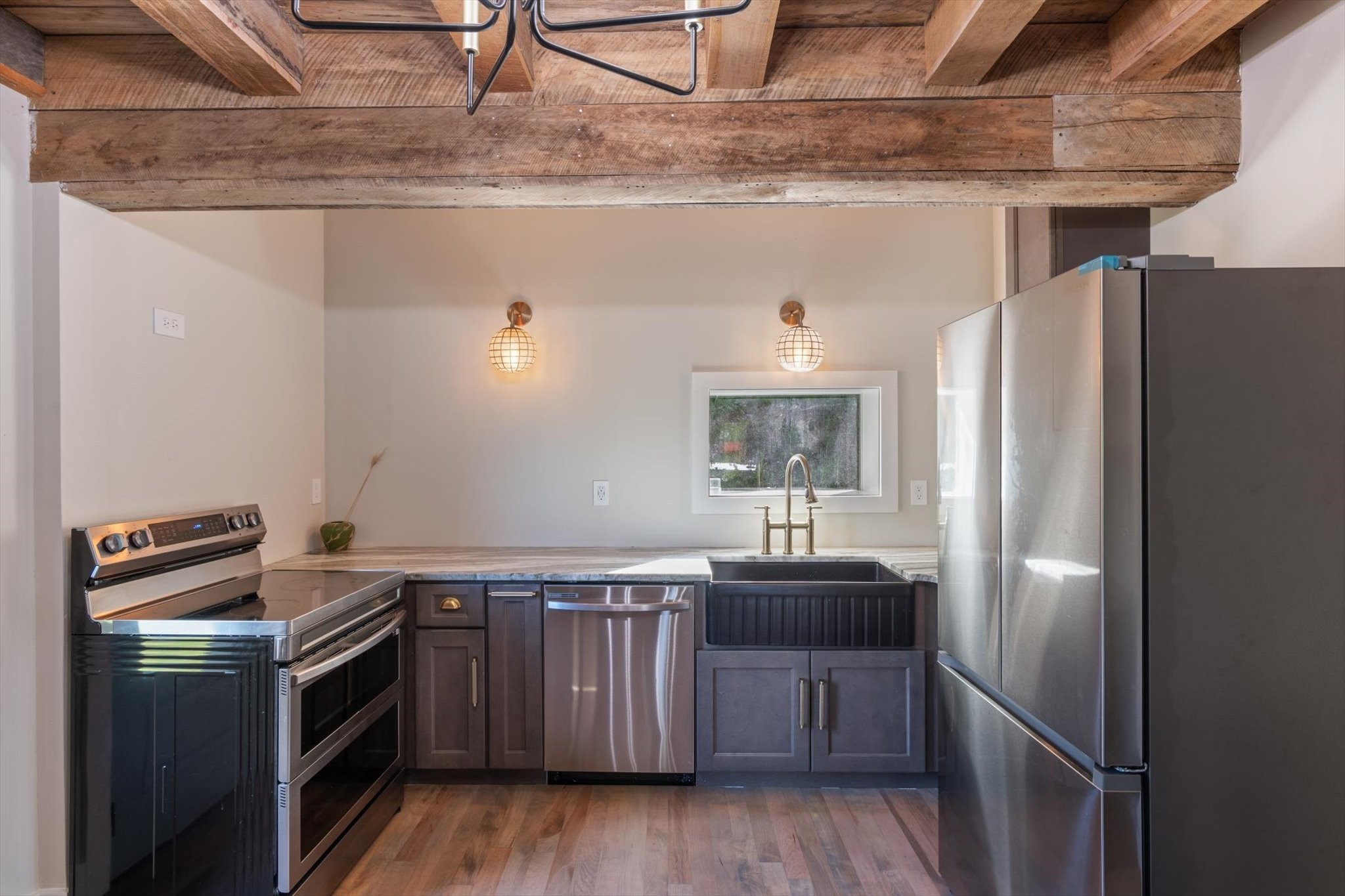 8315 West Sheepneck Road Mount Pleasant, TN 38474 - Photo 10 of 24 a kitchen with stainless steel appliances granite countertop a refrigerator a sink a stove and oven