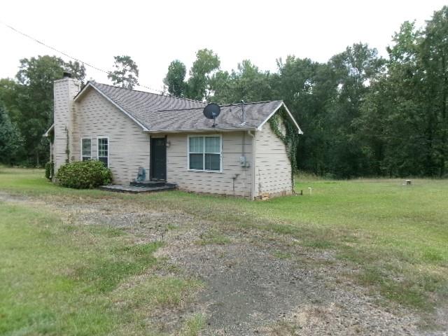 13234 4 Forks Road Keithville, LA 71047 - Photo 17 of 19 a view of a backyard with barn and large trees