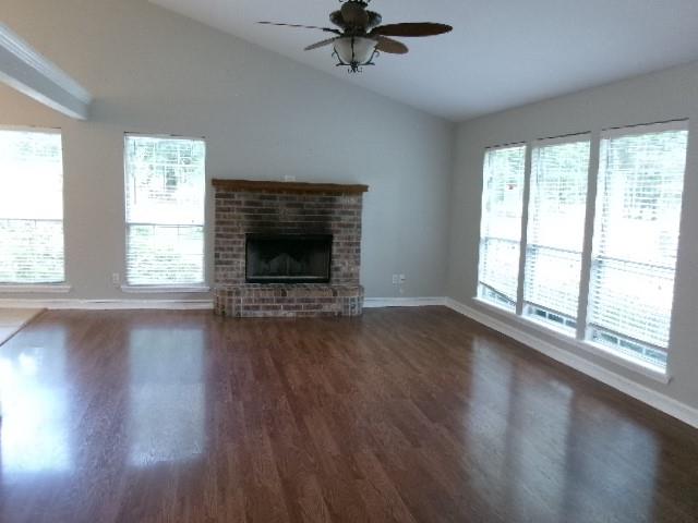 13234 4 Forks Road Keithville, LA 71047 - Photo 3 of 19 wooden floor fireplace and windows in an empty room