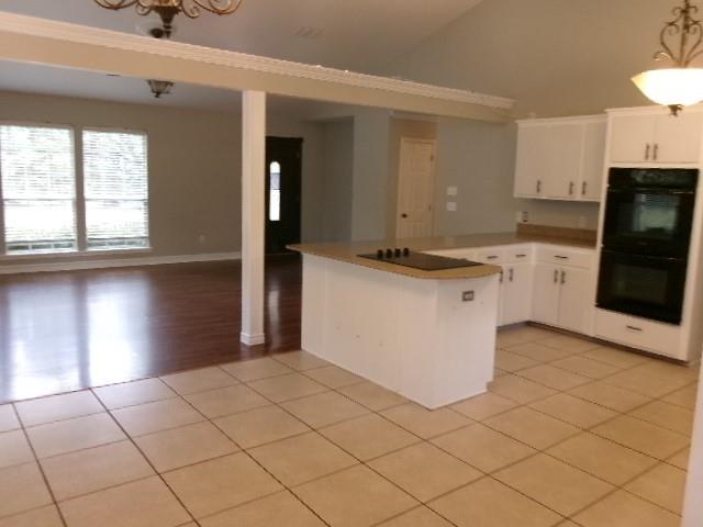 13234 4 Forks Road Keithville, LA 71047 - Photo 10 of 19 a kitchen with stainless steel appliances granite countertop a stove a sink and a refrigerator