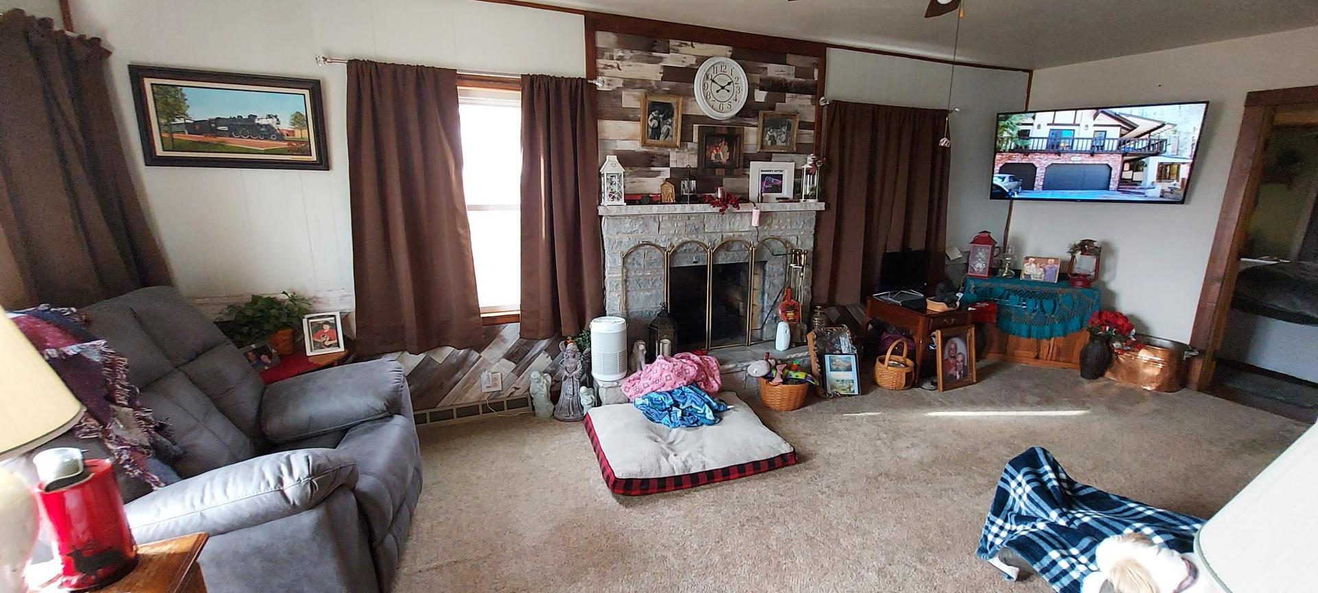 1640 170th Avenue Reynolds, IL 61279 - Photo 13 of 33 a living room with furniture and a fireplace