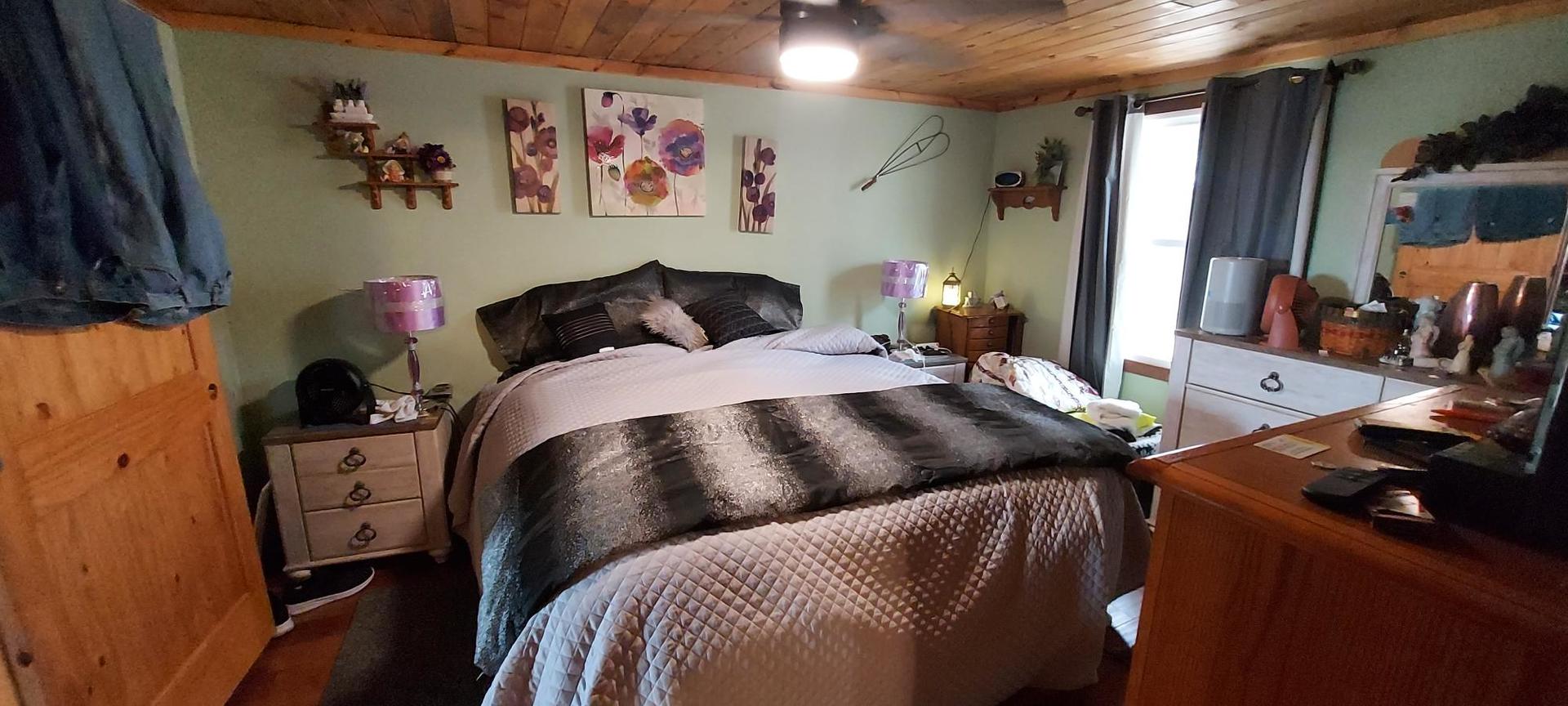 1640 170th Avenue Reynolds, IL 61279 - Photo 16 of 33 a bedroom with a bed and a desk