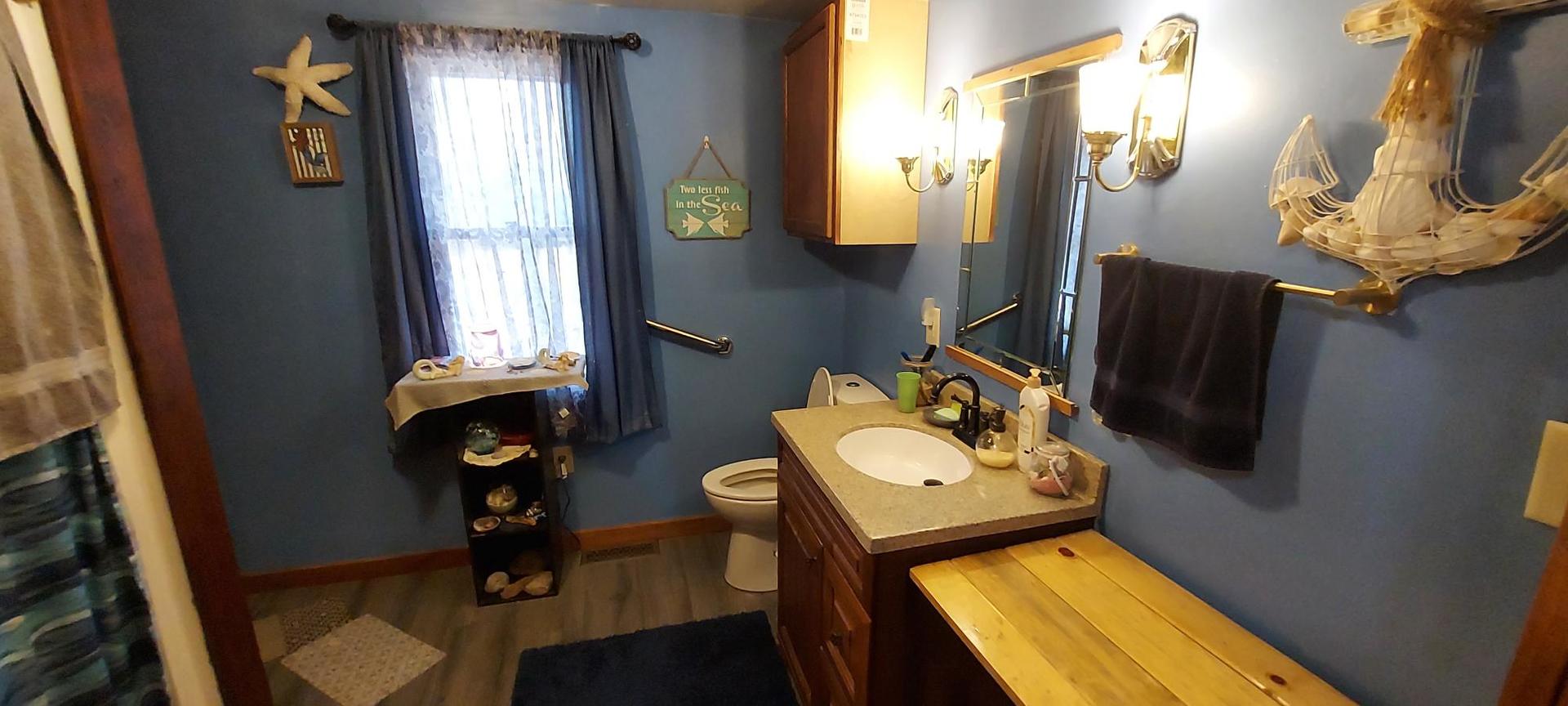 1640 170th Avenue Reynolds, IL 61279 - Photo 18 of 33 a bathroom with a sink toilet and mirror