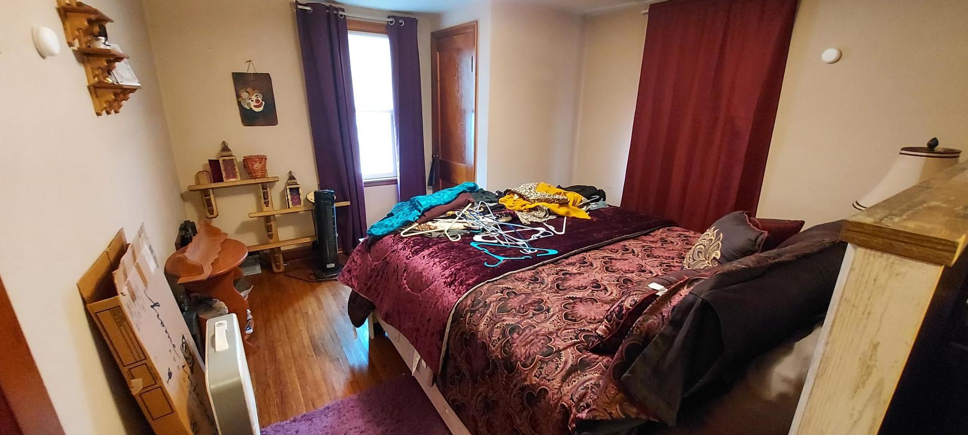 1640 170th Avenue Reynolds, IL 61279 - Photo 24 of 33 a bedroom with a bed and a window