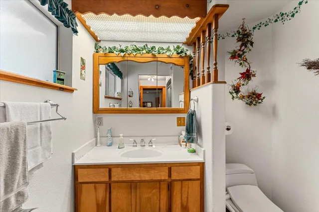 a bedroom with bed and a chandelier