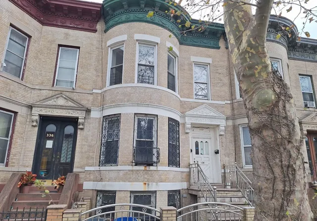 a front view of a building with glass windows